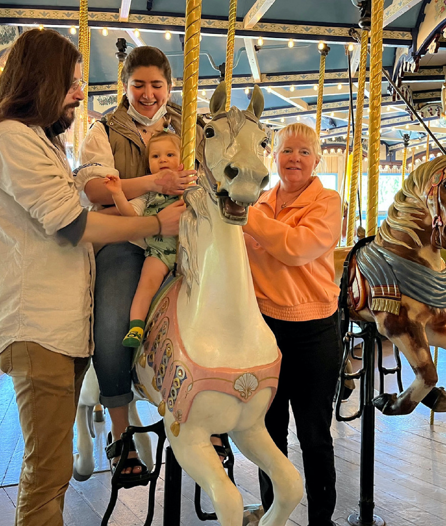 A family enjoys the carousel at Peddler’s Village in Lahaska, Pennsylvania.