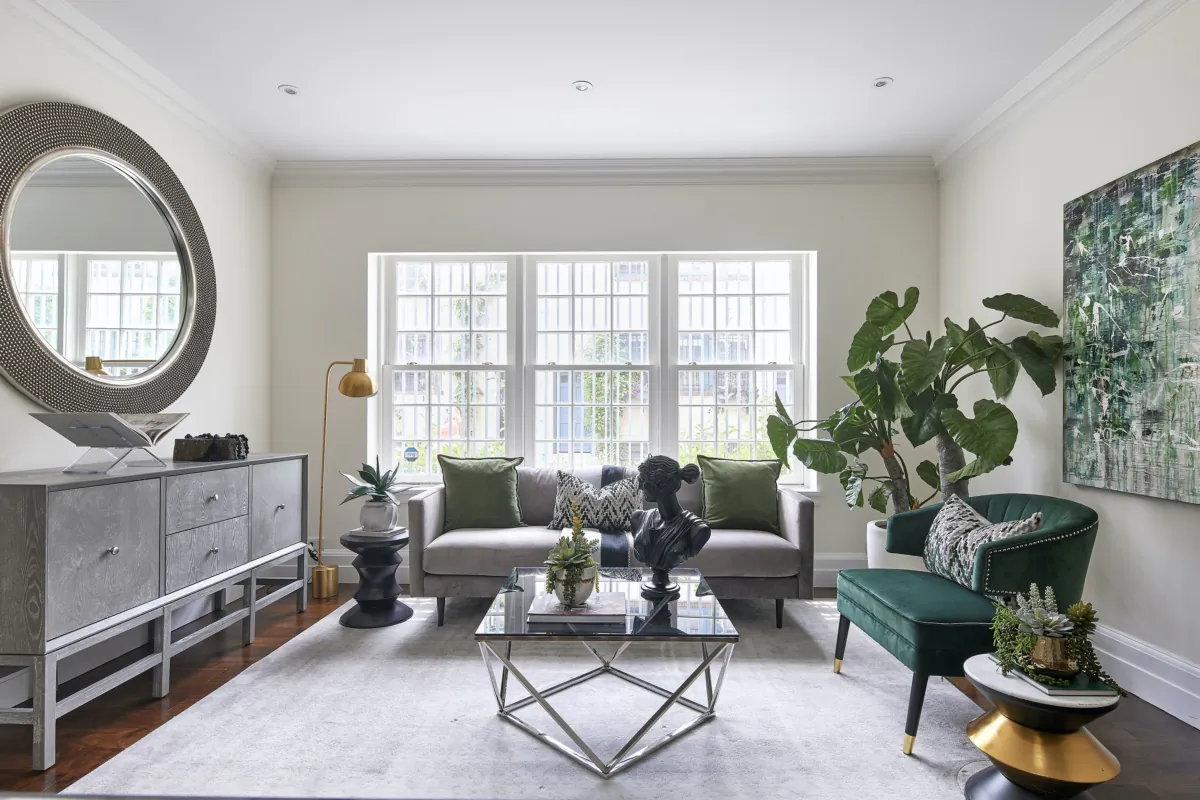 Shades of green repeated throughout this living room create a cohesive and impactful color scheme. (Handout/TNS)
