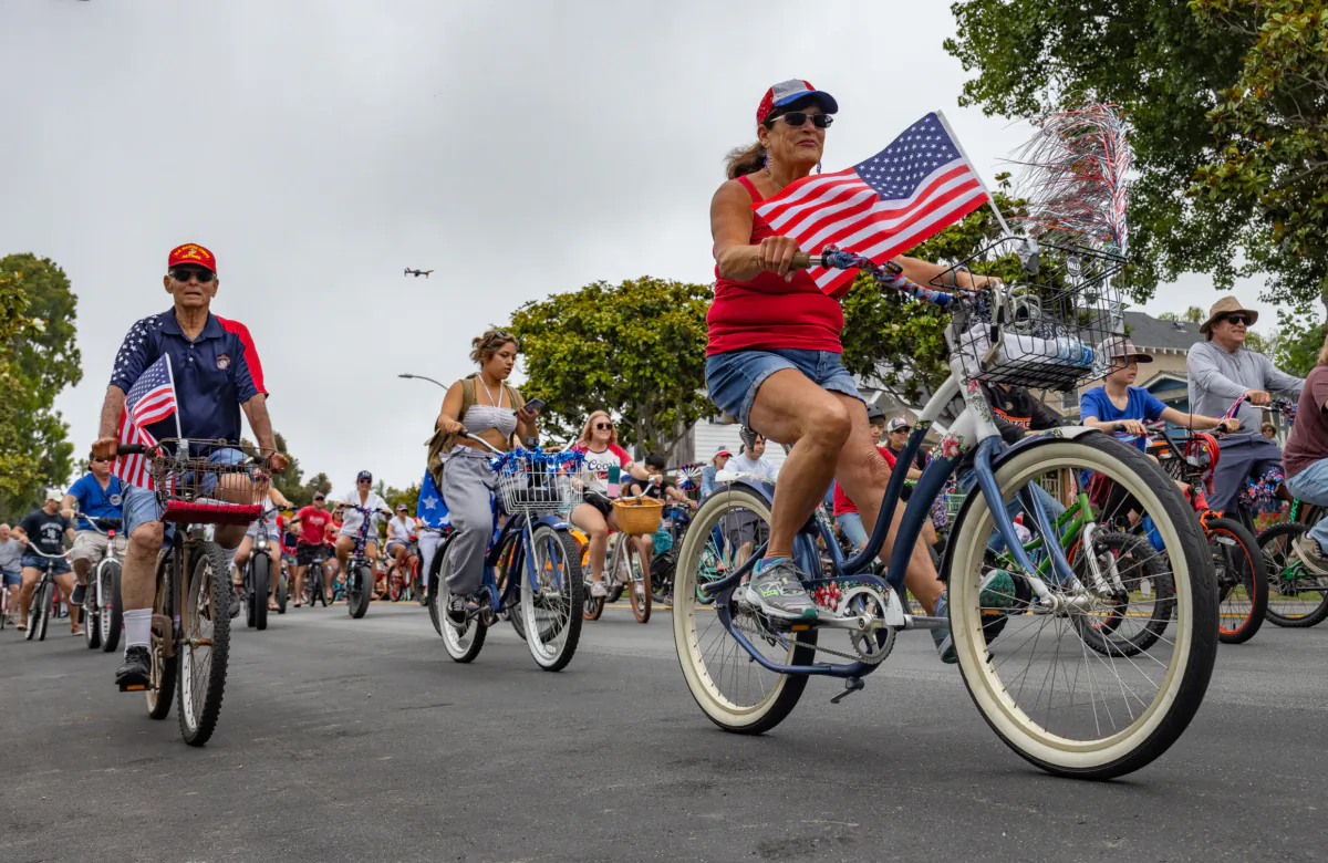 Patriotic locals take part in the 4th Annual 4th of July Bicycle Cruise in Huntington Beach, Calif., on July 1, 2023. (John Fredricks/The Epoch Times)