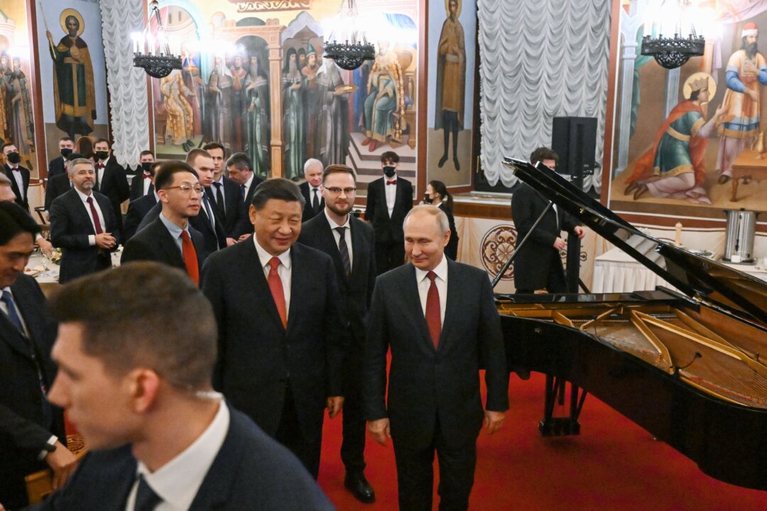 Russian President Vladimir Putin and Chinese leader Xi Jinping leave after a reception following their talks at the Kremlin in Moscow on March 21, 2023. (Grigory Sysoyev/SPUTNIK/AFP via Getty Images)