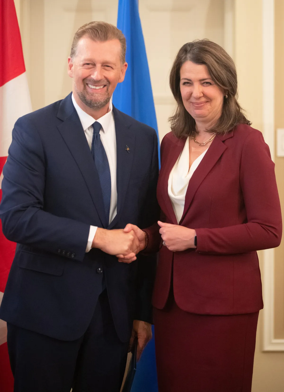 Alberta Premier Danielle Smith and Deputy Premier and Minister of Public Safety and Emergency Services Mike Ellis stand together during the swearing in of her cabinet, in Edmonton on June 9, 2023. (Jason Franson/The Canadian Press)