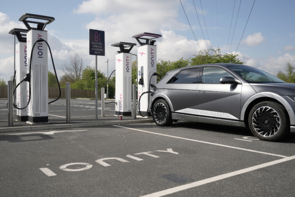 A Hyundai Ioniq battery electric vehicle (BEV) charges at an Ionity GmbH electric car charging station at Skelton Lake motorway service area on April 26, 2022 in Leeds, England. According to a report from the Society of Motor Manufacturers And Traders, there were more new electric vehicle registrations in the UK in March 2022 than all of 2019. However, overall car sales slumped amid rising fuel prices and the car industry's supply chain problems.{Christopher Furlong/Getty Images)