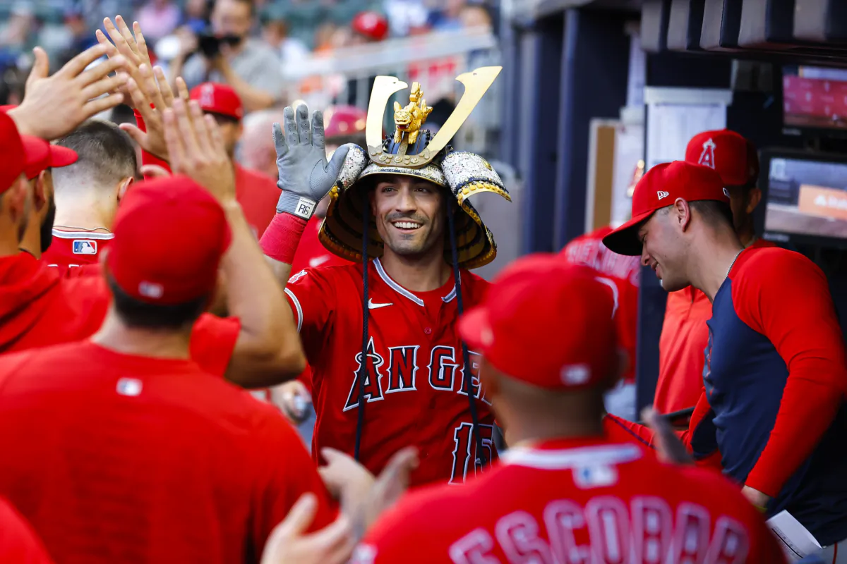 Randal Grichuk (15) reacts after hitting a home run during the fourth inning against the Atlanta Braves at Truist Park in Atlanta on July 31, 2023. (Todd Kirkland/Getty Images)