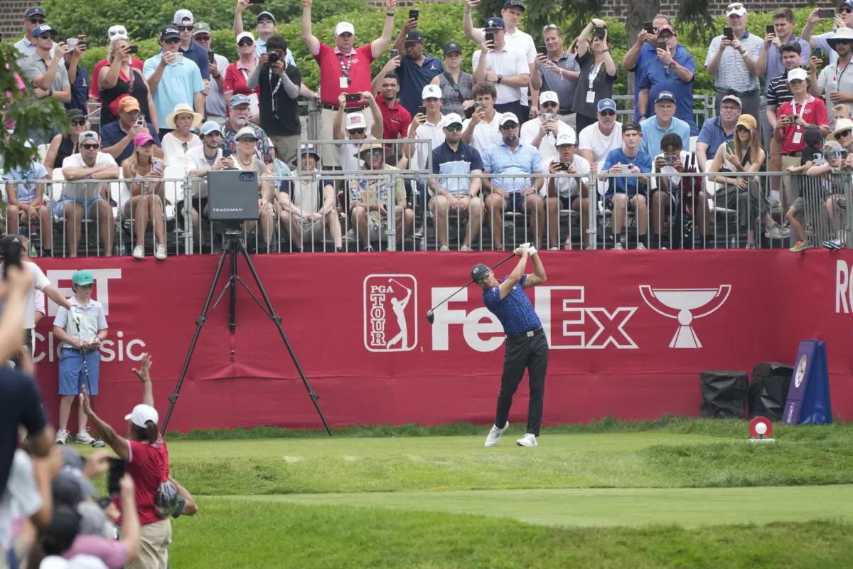 Rickie Fowler drives off the first tee during the third round of the Rocket Mortgage Classic golf tournament at Detroit Country Club in Detroit on July 1, 2023. (Carlos Osorio/AP Photo)