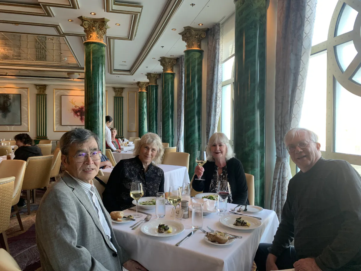 The author and her husband (right) dine with longtime friends Karen and Kenzo Takizawa from Tokyo, who enjoyed their first cruise. (Photo courtesy of Sharon Whitley Larsen)