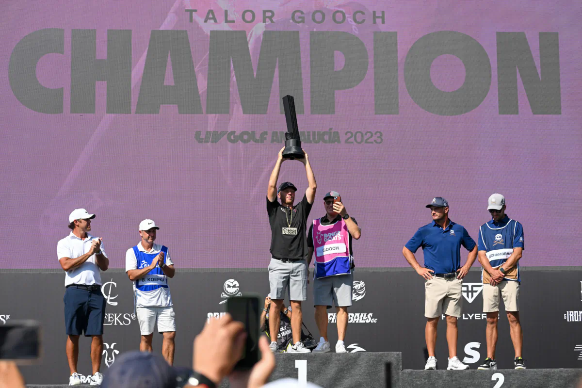 Talor Gooch of RangeGoats GC celebrates with the trophy after winning the LIV Golf—Andalucia at Real Club Valderrama in Cadiz, Spain on July 2, 2023. (Octavio Passos/Getty Images)