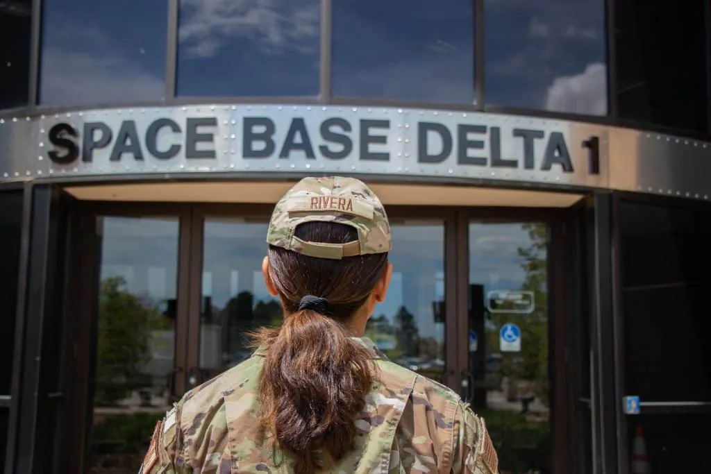 Airman 1st Class Dianne Rivera stands in front of Space Base Delta 1's Headquarters at Peterson Space Force Base, on May 17, 2023. Rivera works in finance, helping to keep SBD1 on budget and its Airmen paid. (U.S. Air Force Photo by Emily Peacock)