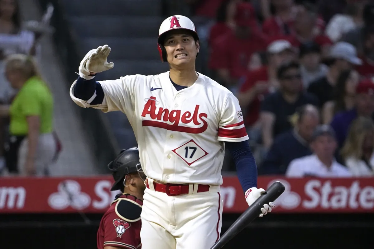 Los Angeles Angels' Shohei Ohtani grimaces after swinging for a strike during the fourth inning of a baseball game against the Arizona Diamondbacks in Anaheim, Calif., on July 1, 2023. (Mark J. Terrill/AP Photo)