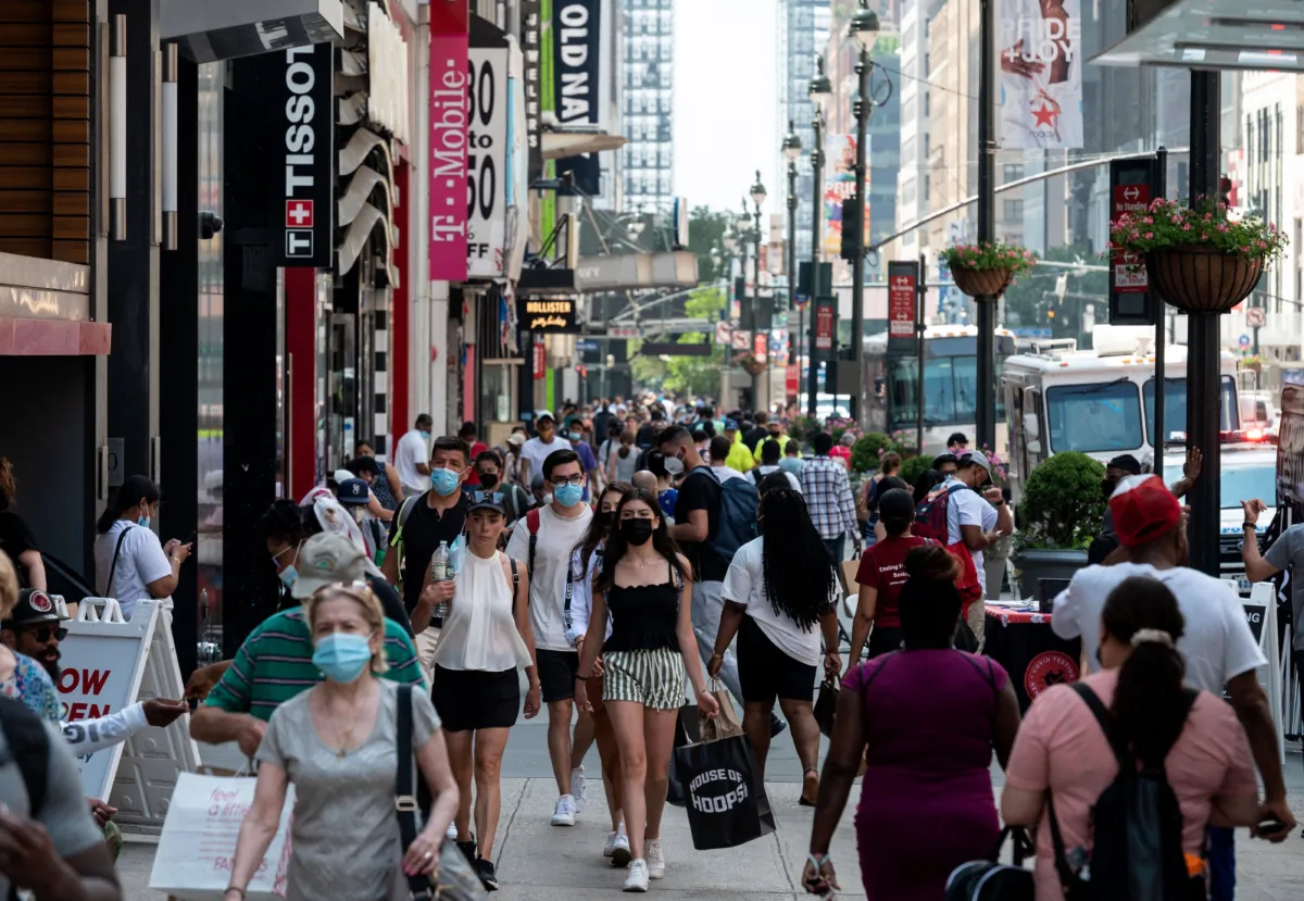 People walk through a shopping area in New York City, on June 7, 2021.. (Photo by Angela Weiss / AFP via Getty Images)