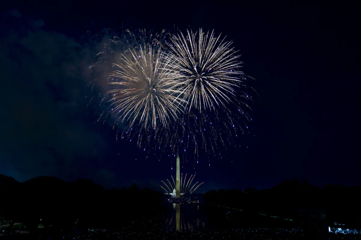 Fireworks go off above the Washington Monument and the U.S. Capitol during an Independence Day fireworks display at the Lincoln Memorial in Washington on July 4, 2022. (Stefani Reynolds/AFP via Getty Images)