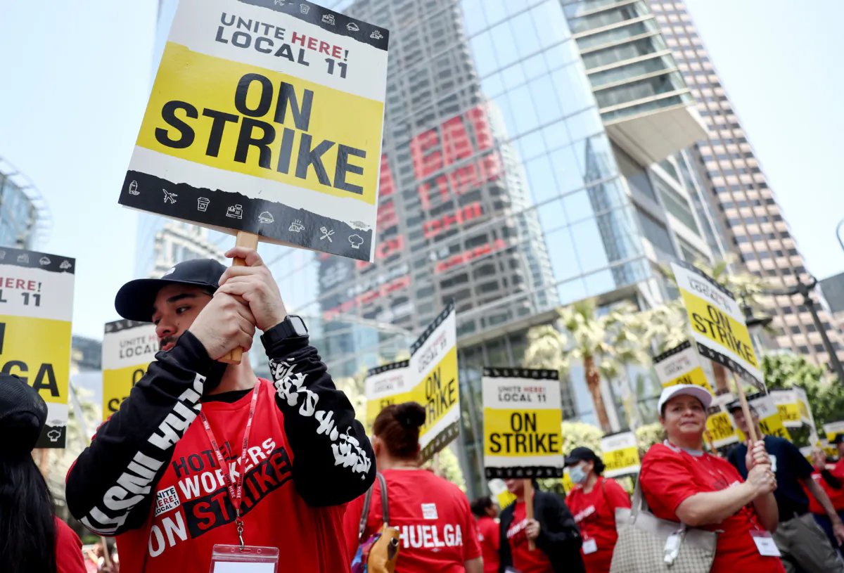 Hotel workers with Unite Here Local 11 picket outside the InterContinental hotel on the first day of a strike by union members at many major hotels in Southern California, in Los Angeles, on July 2, 2023. (Mario Tama/Getty Images)