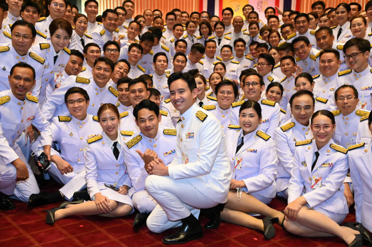 Pita Limjaroenrat, Move Forward leader, poses with members of parliament before Thailand's King Maha Vajiralongkorn inaugurates the opening of parliament in Bangkok, Thailand, on July 3, 2023. (Thai Parliament/Handout via Reuters)