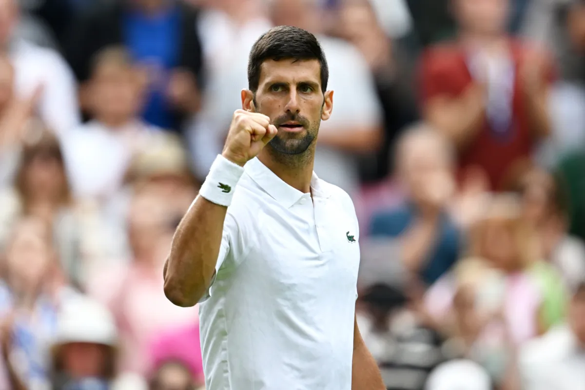 Novak Djokovic of Serbia celebrates winning match point against Pedro Cachin of Argentina in the men's singles first round match on day one of The Championships Wimbledon 2023 at All England Lawn Tennis and Croquet Club in London on July 3, 2023. (Shaun Botterill/Getty Images)