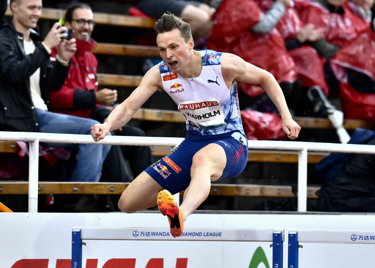 Norway's Karsten Warholm competes during the men's 400-meter hurdles competition of the Diamond League gala in Stockholm on July 2, 2023. (Fredrik Persson/various sources/AFP via Getty Images)