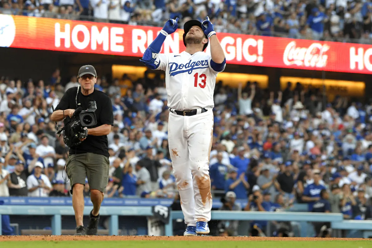 Los Angeles Dodgers' Max Muncy gestures as he score after hitting a solo home run during the second inning of a baseball game against the Pittsburgh Pirates in Los Angeles on July 3, 2023. (Mark J. Terrill/AP Photo)