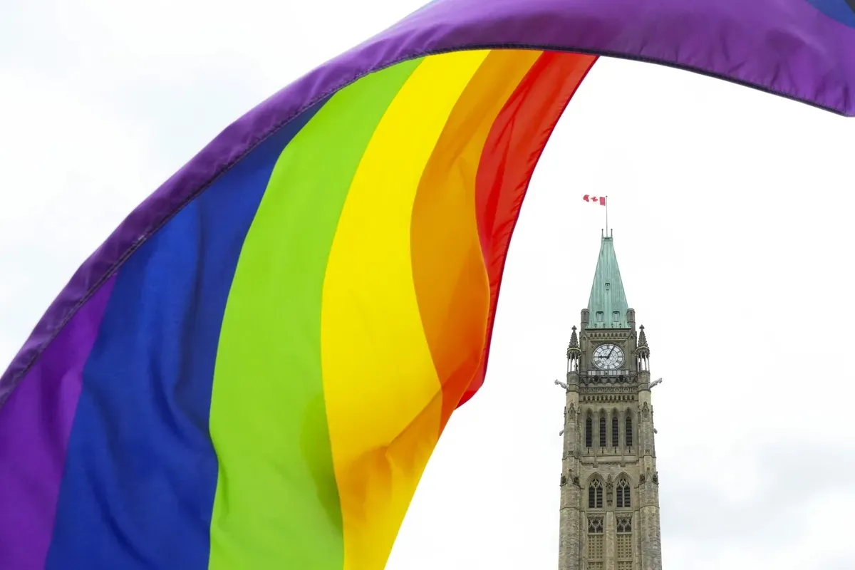 A Pride flag flies on Parliament Hill in Ottawa on June 8, 2023, during a Pride event. (Sean Kilpatrick/The Canadian Press)