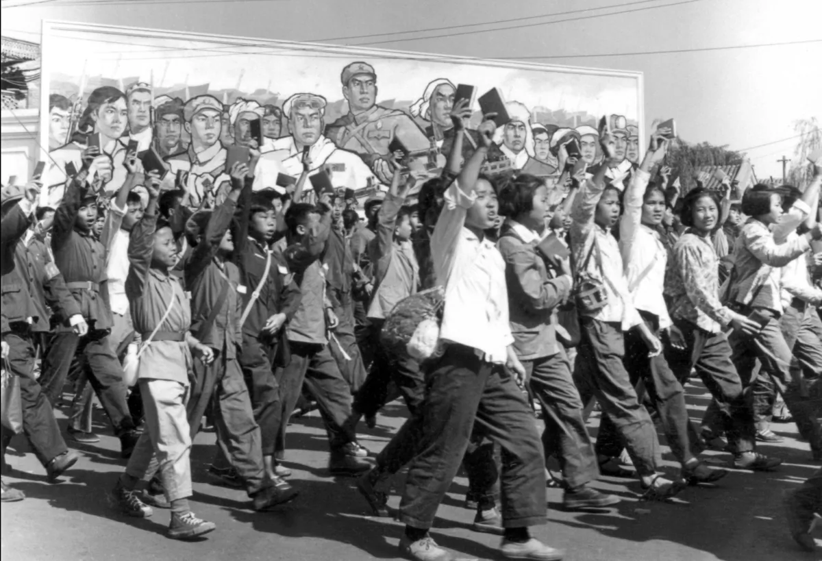 Red Guard members wave copies of Chairman Mao’s “Little Red Book” during a parade in Beijing in June 1966. In handling differences, revolutionaries are unique. They use inclusive symbols such as “the people” to project an illusion of harmony, writes Marco Navarro-Génie. (Jean Vincent/AFP via Getty Images)