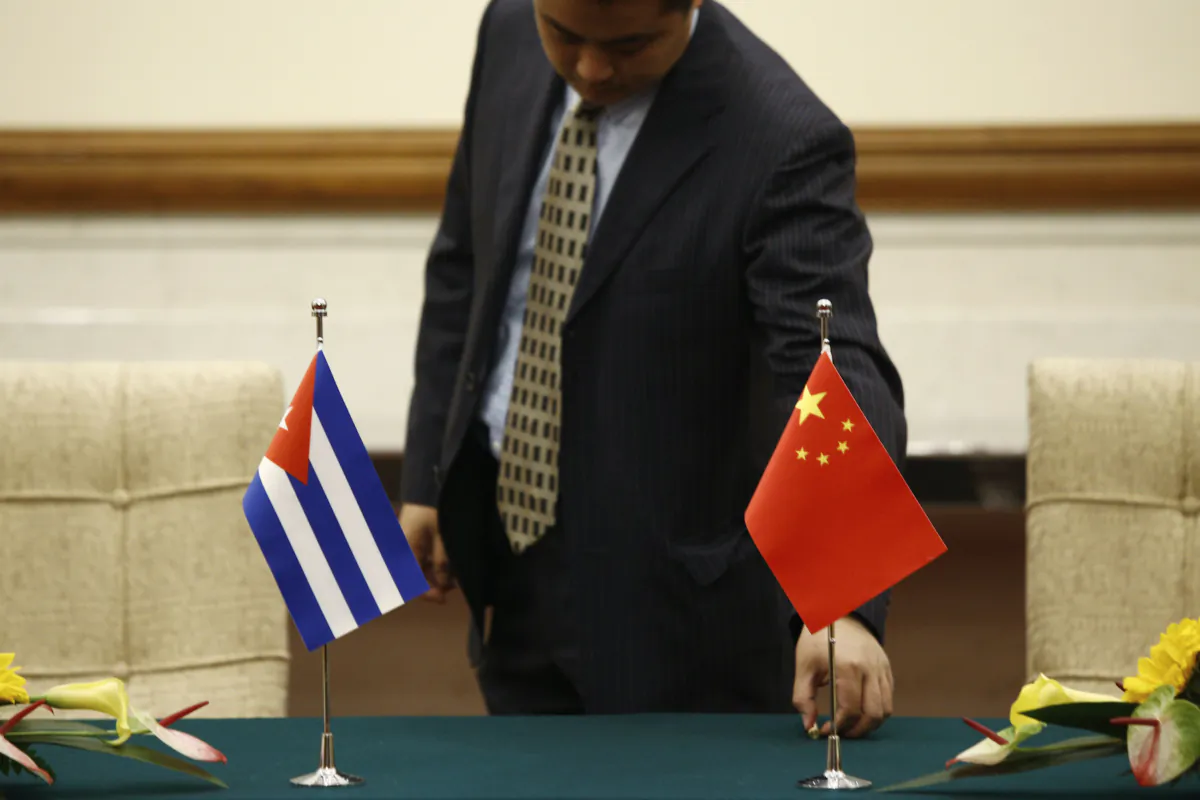 A staff member inspects a pen before the signing ceremony by Cuban Foreign Minister Bruno Rodriguez and Chinese Foreign Minister Wang Yi at Diaoyutai state guesthouse in Beijing, China, on May 29, 2019. (Florence Lo/Pool/Getty Images)