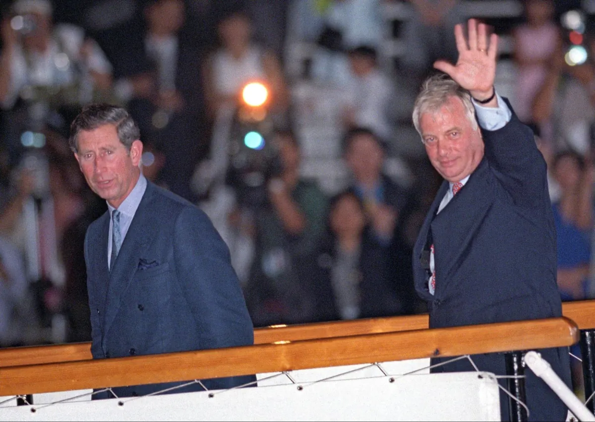 The last Hong Kong governor Chris Patten (R), waved to well-wishers in July 1997 before he departed from Hong Kong. (ROMEO GACAD / AFP)
