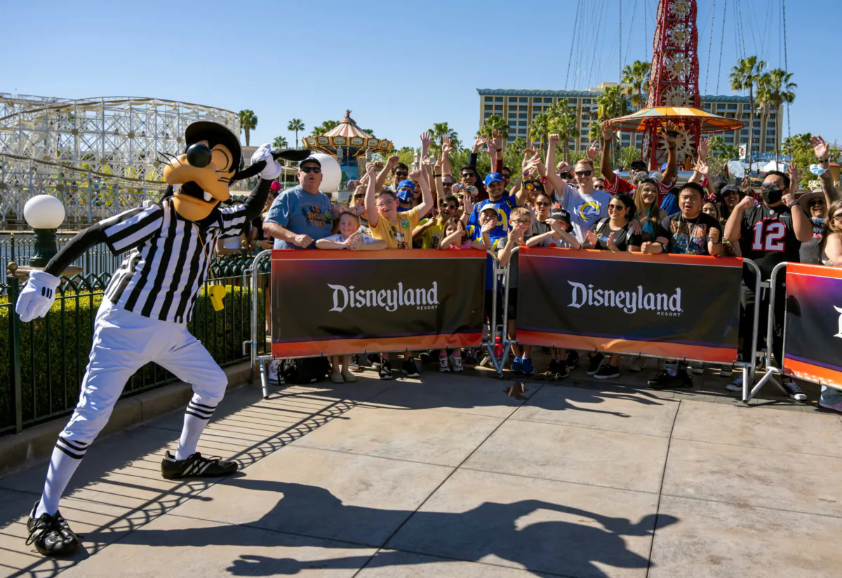 Goofy, left, rallies the crowd gathered to watch ESPN broadcast a Super Bowl preview show from Disney California Adventure in Anaheim, California on Thursday, Feb. 10, 2022. (Leonard Ortiz/Orange County Register/TNS)