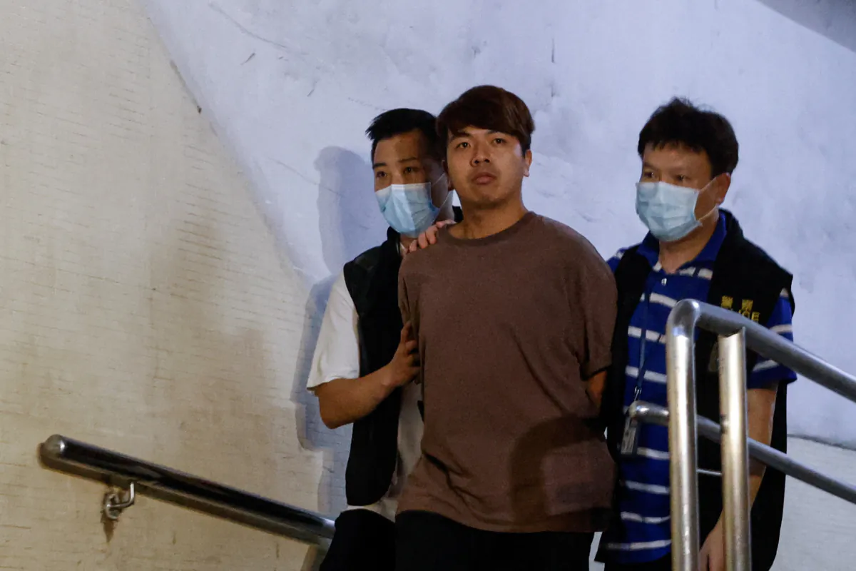 Political activist Ivan Lam Long-yin is arrested by national security police in Hong Kong on suspicion of conspiracy to collude with foreign forces and acts with seditious intent, in Hong Kong on July 5, 2023. (Tyrone Siu/Reuters)