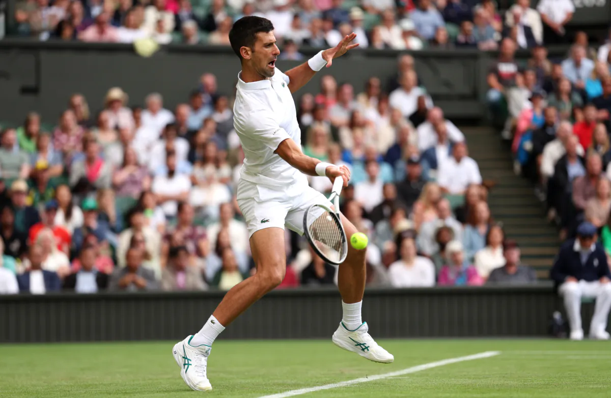 Novak Djokovic of Serbia hits a forehand against Jordan Thompson of Australia in the Men's Singles second round match during day three of The Championships Wimbledon 2023 at All England Lawn Tennis and Croquet Club in London on July 5, 2023. (Patrick Smith/Getty Images)