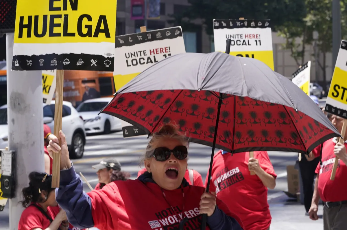 Striking hotel workers rally outside the InterContinental Los Angeles Downtown Hotel in downtown Los Angeles on July 4, 2023. (Damian Dovarganes/AP Photo)