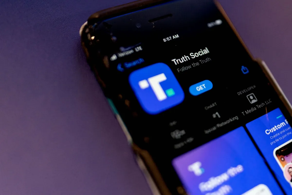 A phone screen displays the Truth Social app in Washington, on Feb. 21, 2022. (Stefani Reynolds/AFP via Getty Images)