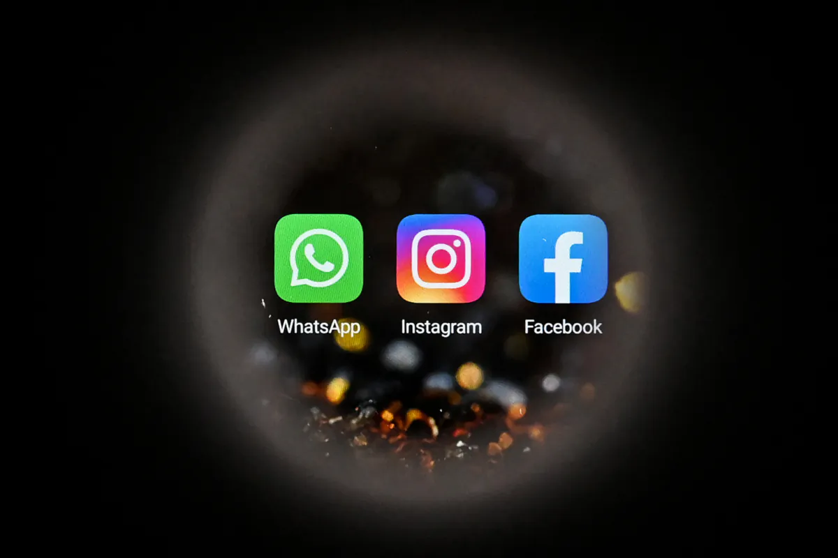 The logos of Facebook, WhatsApp, and Instagram are seen on a smartphone screen in Moscow on Oct. 5, 2021. (Kirill Kudryavtsev/AFP via Getty Images)