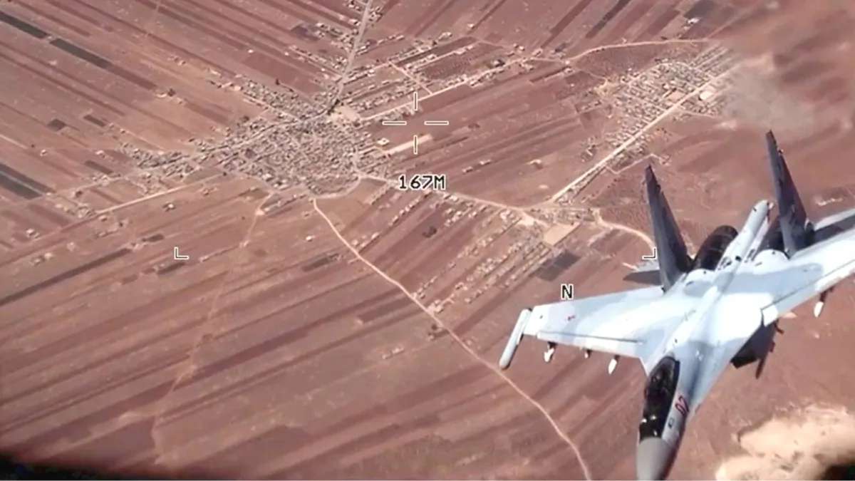 A Russian SU-35 flies near a U.S. Air Force MQ-9 Reaper drone over Syria on July 5, 2023. (U.S. Air Force via AP)