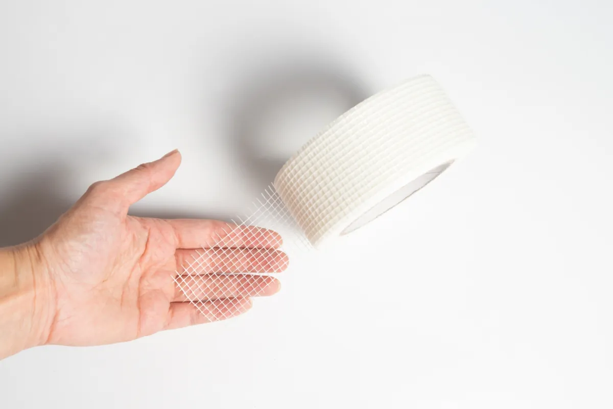 According to James Dulley, the best crack repair procedure involves laying fiberglass joint tape over the crack and finishing it with joint compound. (mdbildes/Shutterstock)
