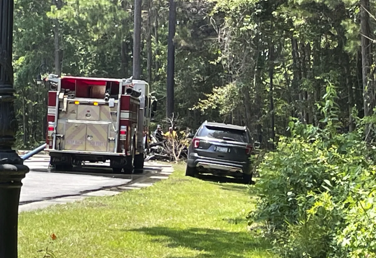 Emergency personnel respond to a single-engine plane crash in the area of Barefoot Landing in North Myrtle Beach, S.C., on July 2, 2023. (Terri Richardson/The Sun News via AP)