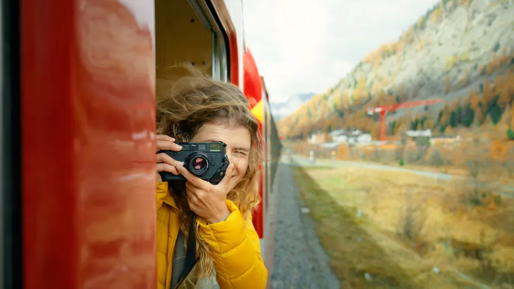 If you’re not in a rush to get to the destination, enjoy the trip by taking a train. (BublikHaus/Shutterstock)