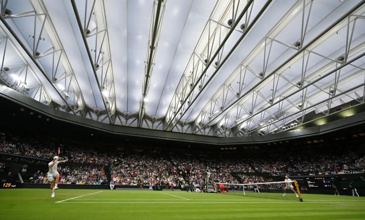 Britain's Andy Murray (L) returns the ball to Greece's Stefanos Tsitsipas during their men's singles tennis match on the fourth day of the 2023 Wimbledon Championships at The All England Tennis Club in Wimbledon, southwest London, on July 6, 2023. (Glyn Kirk/AFP via Getty Images)