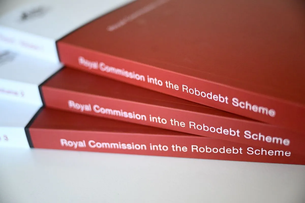 A copy of the Report of the Royal Commission into the Robodebt Scheme is seen at Parliament House in Canberra, July 7, 2023. (AAP Image/Lukas Coch)
