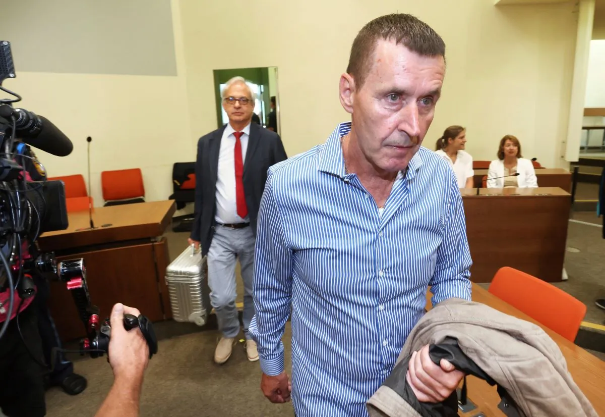 Manfred Genditzki, (R), arrives in the courtroom in Munich, Germany, on July 7, 2023. (Karl-Josef Hildenbrand/dpa via AP)