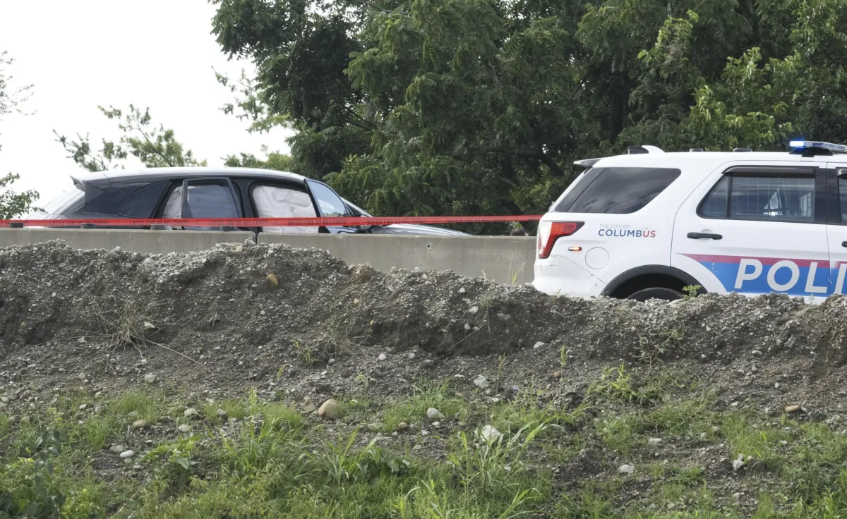 Police investigate and mark the crime scene on I70 in Columbus, Ohio, on July 6, 2023. (Brooke LaValley/The Columbus Dispatch via AP)