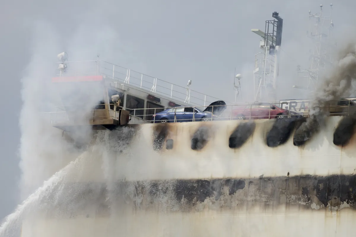Emergency personnel battle against a fire aboard the Italian-flagged Grande Costa d'Avorio cargo ship at the Port of Newark in Newark, N.J., on July 7, 2023. (John Minchillo/AP Photo)