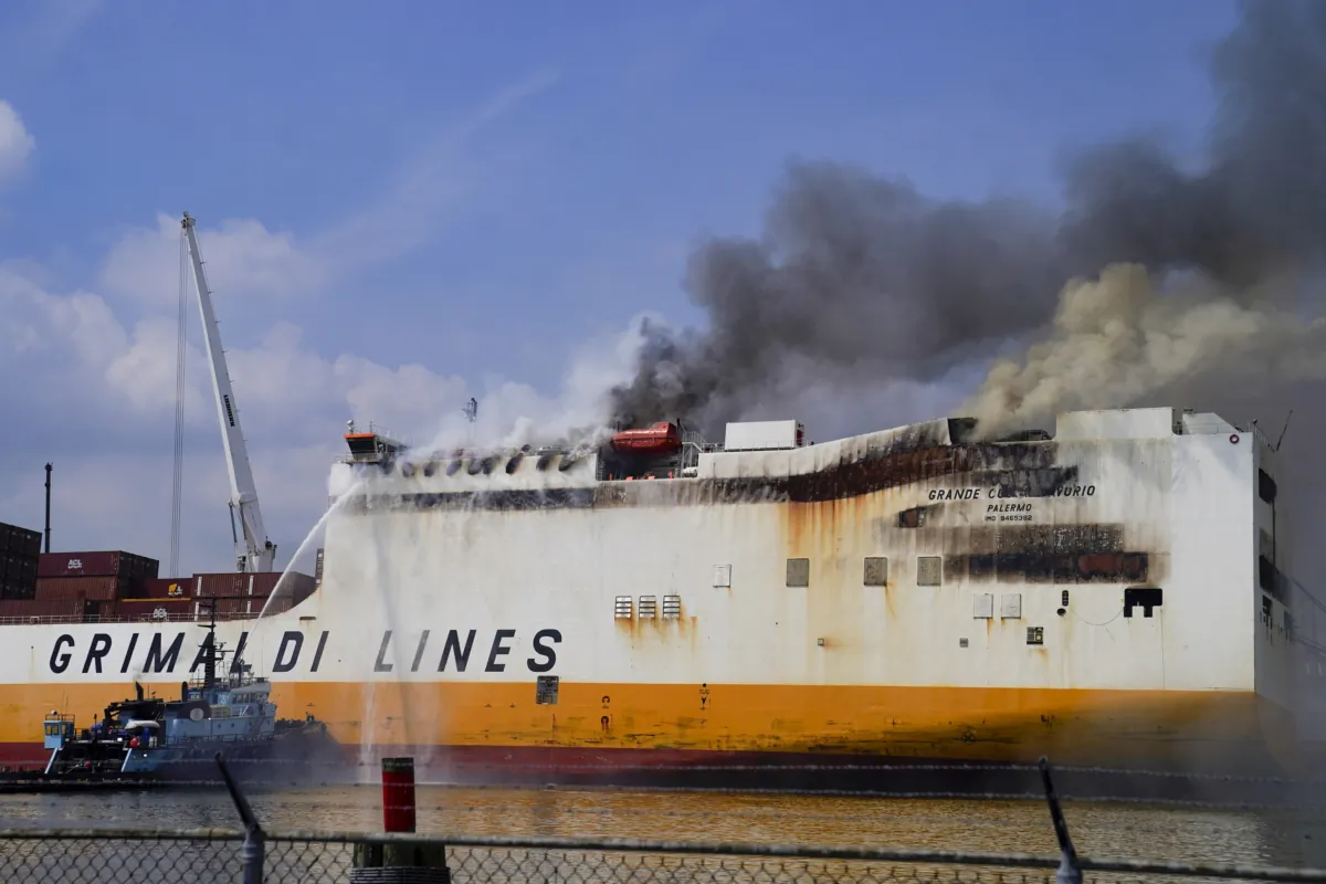 Emergency personnel battle against a fire aboard the Italian-flagged Grande Costa d'Avorio cargo ship at the Port of Newark in Newark, N.J., on July 7, 2023. (John Minchillo/AP Photo)