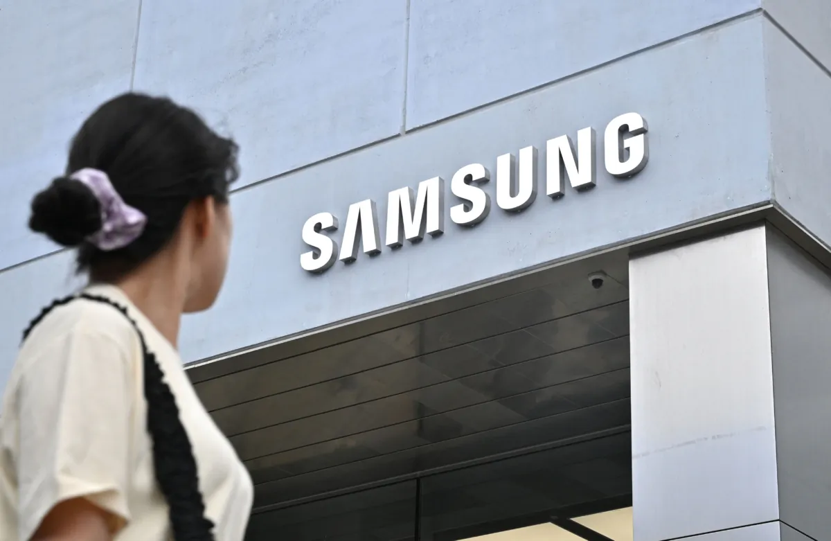 A woman walks past a new flagship store of Samsung Electronics at the Gangnam district in Seoul on June 28, 2023. (Jung Yeon-je/AFP via Getty Images)