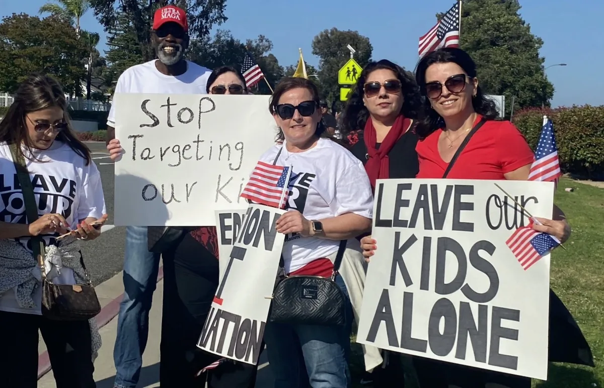 Parents demonstrate at a school board meeting amid controversy surrounding school curriculum in Temecula, Calif., on June 13, 2023. (Micaela Ricaforte/The Epoch Times)