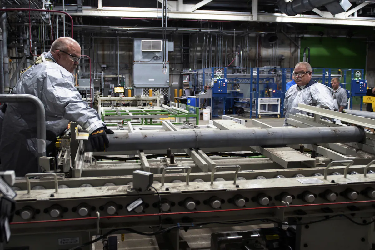 Workers at the Blue Grass Chemical Agent Destruction Pilot Plant in Richmond, Ky., begin the destruction of the first rocket from a stockpile of M55 rockets with GB nerve agent, on July 6, 2022. (U.S. Army via AP)
