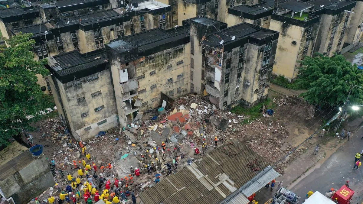 Rescue workers look for victims among debris of a building collapse in Recife, Pernambuco state, Brazil, on July 7, 2023. (Anderson Stevens/Reuters)