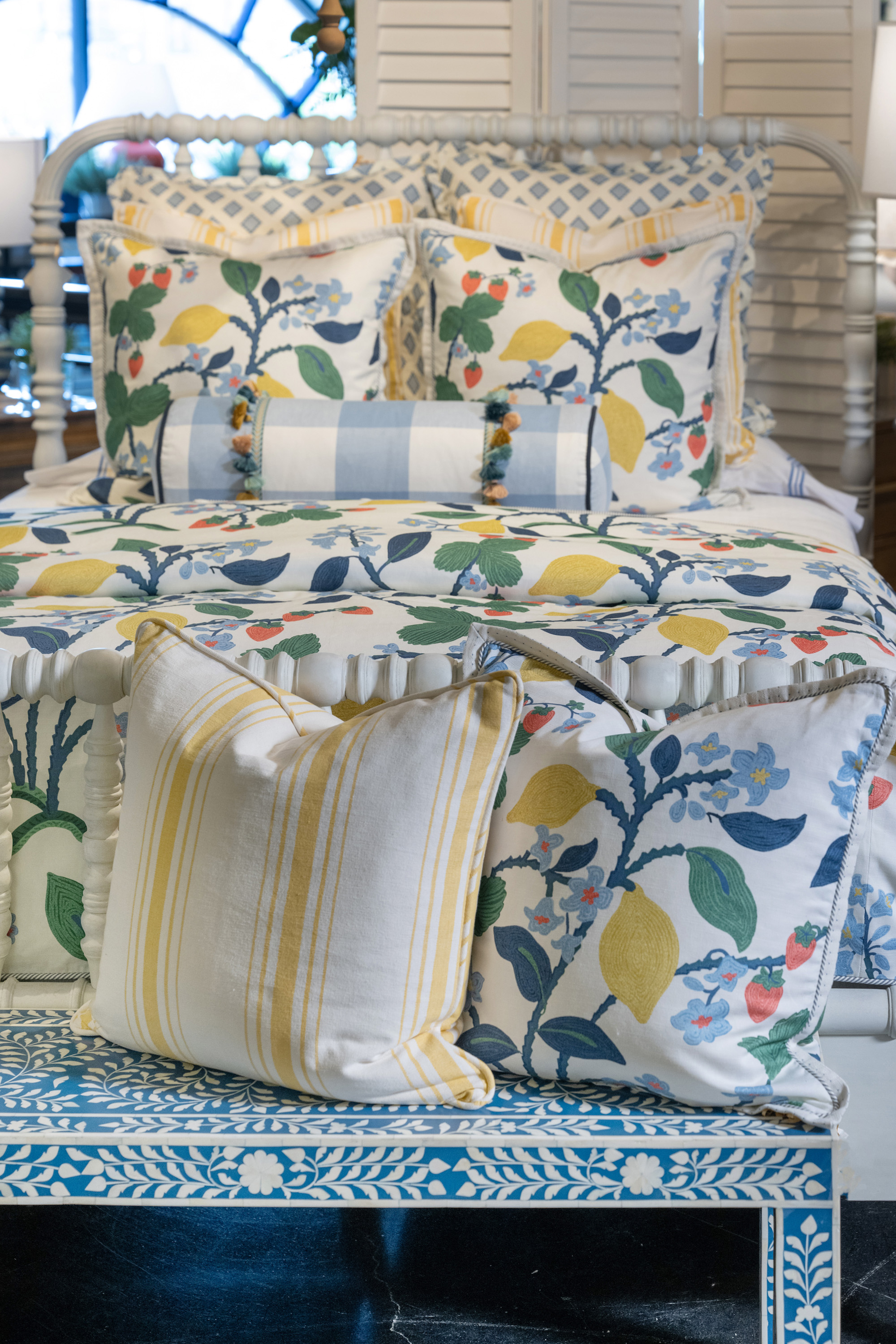 Many pillow trim options working together create an elevated look to this designer bedding set. 