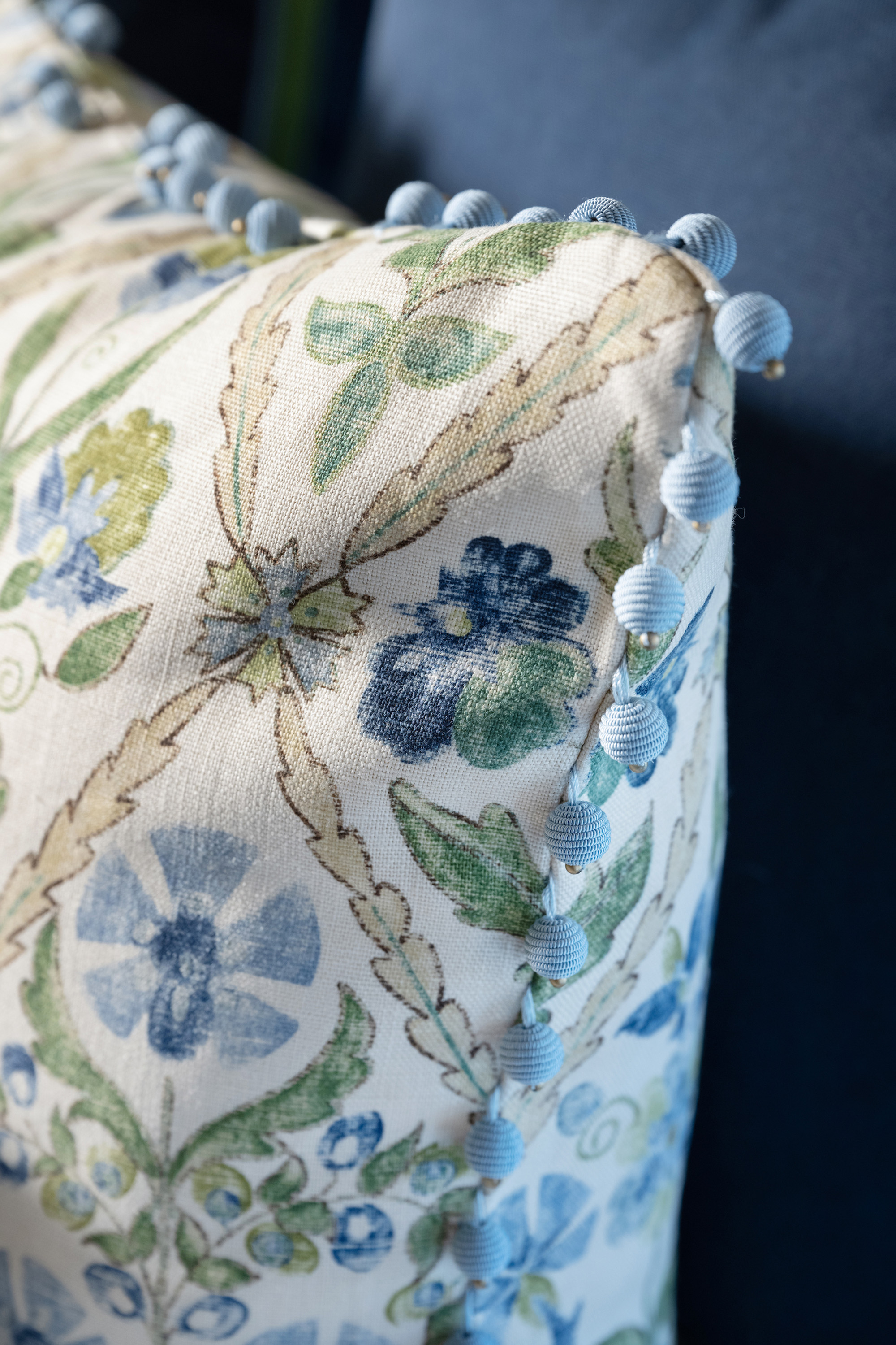 Bauble trim dazzles in this blue and green new traditional bed pillow.