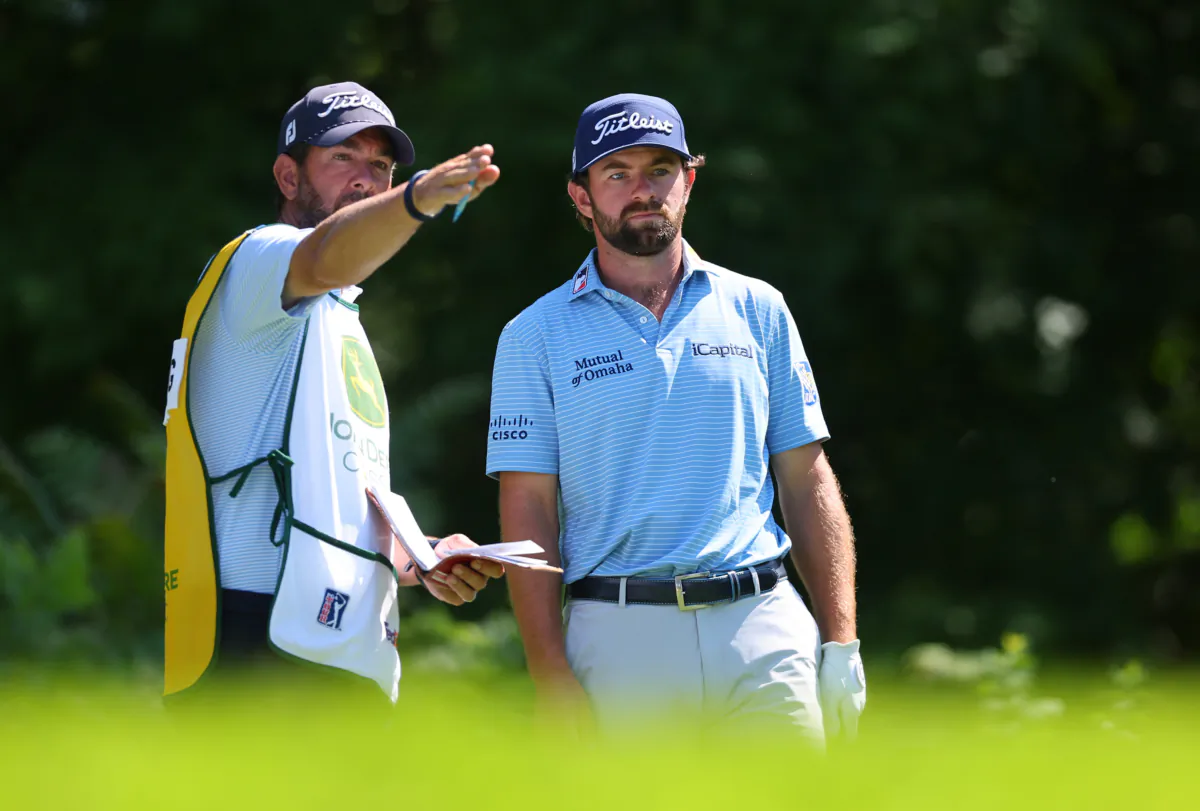 Cameron Young of the United States and caddie Paul Tesori prepare to play his shot from the second tee during the second round of the John Deere Classic at TPC Deere Run in Silvis, Illinois, on July 7, 2023. (Michael Reaves/Getty Images)