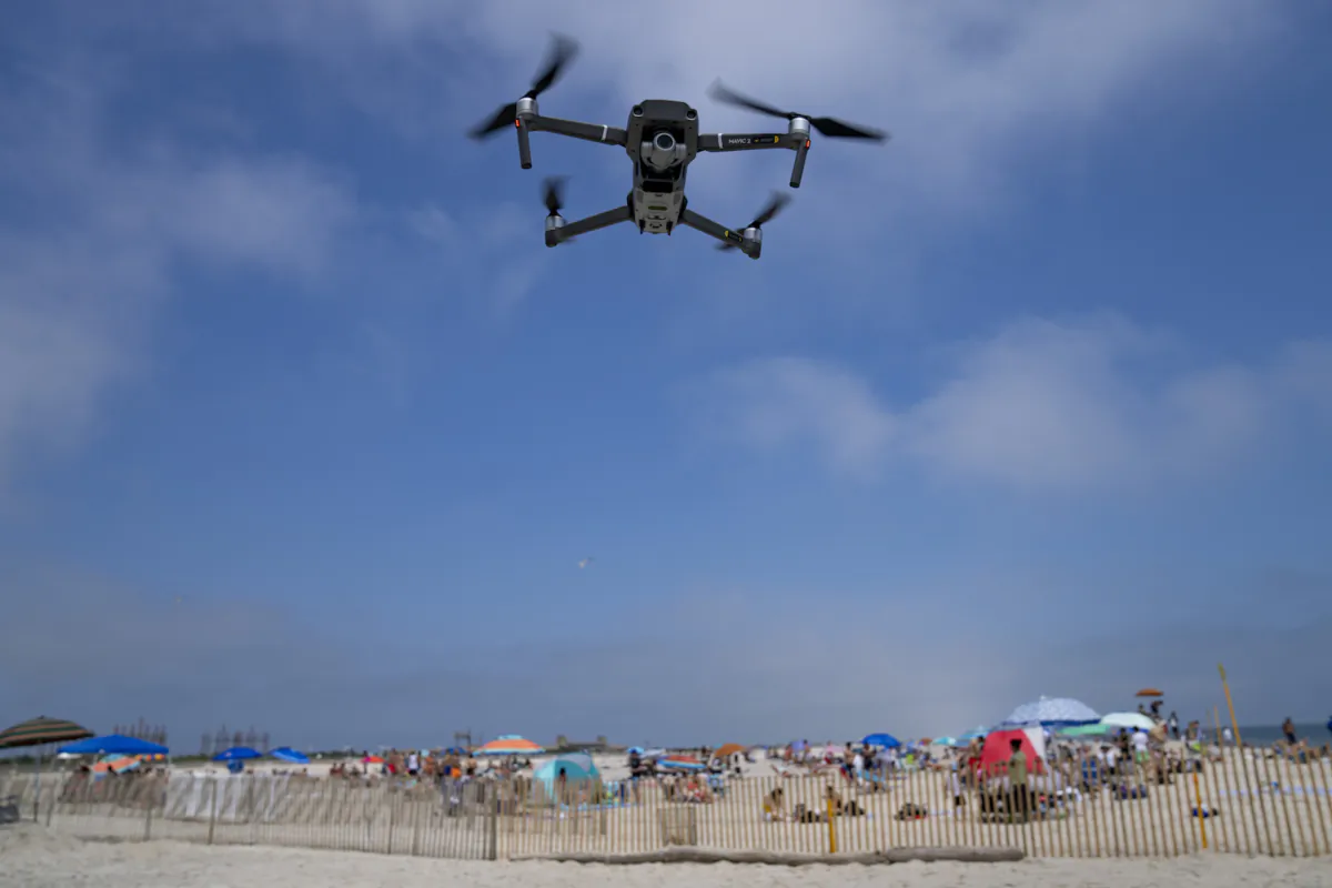 A drone is flown in for a landing after a shark patrol flight at Jones Beach State Park in Wantagh, N.Y., on July 6, 2023. (John Minchillo/AP Photo)