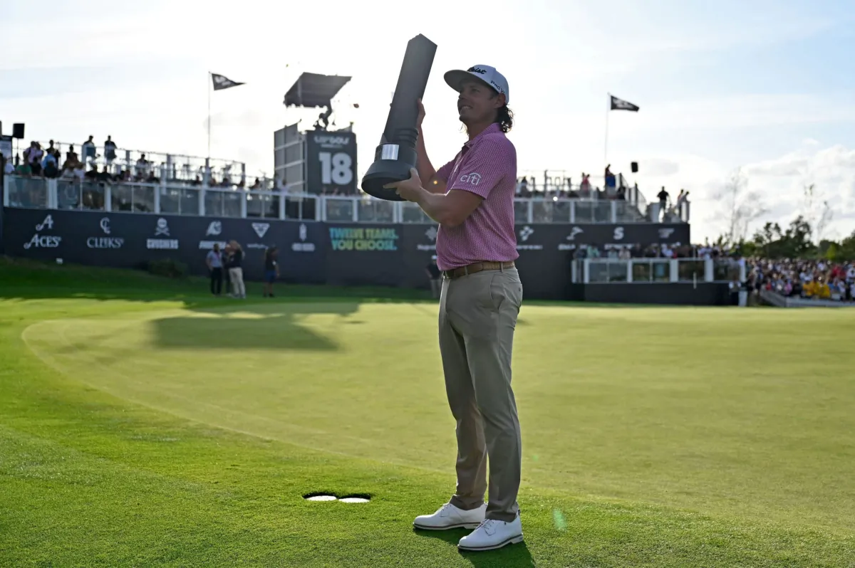 Australia's Cameron Smith poses on the 18th green with the winner's trophy on the final day of the LIV Golf Invitational Series event at The Centurion Club in St Albans, north of London, on July 9, 2023. (Justin Tallis/AFP via Getty Images)