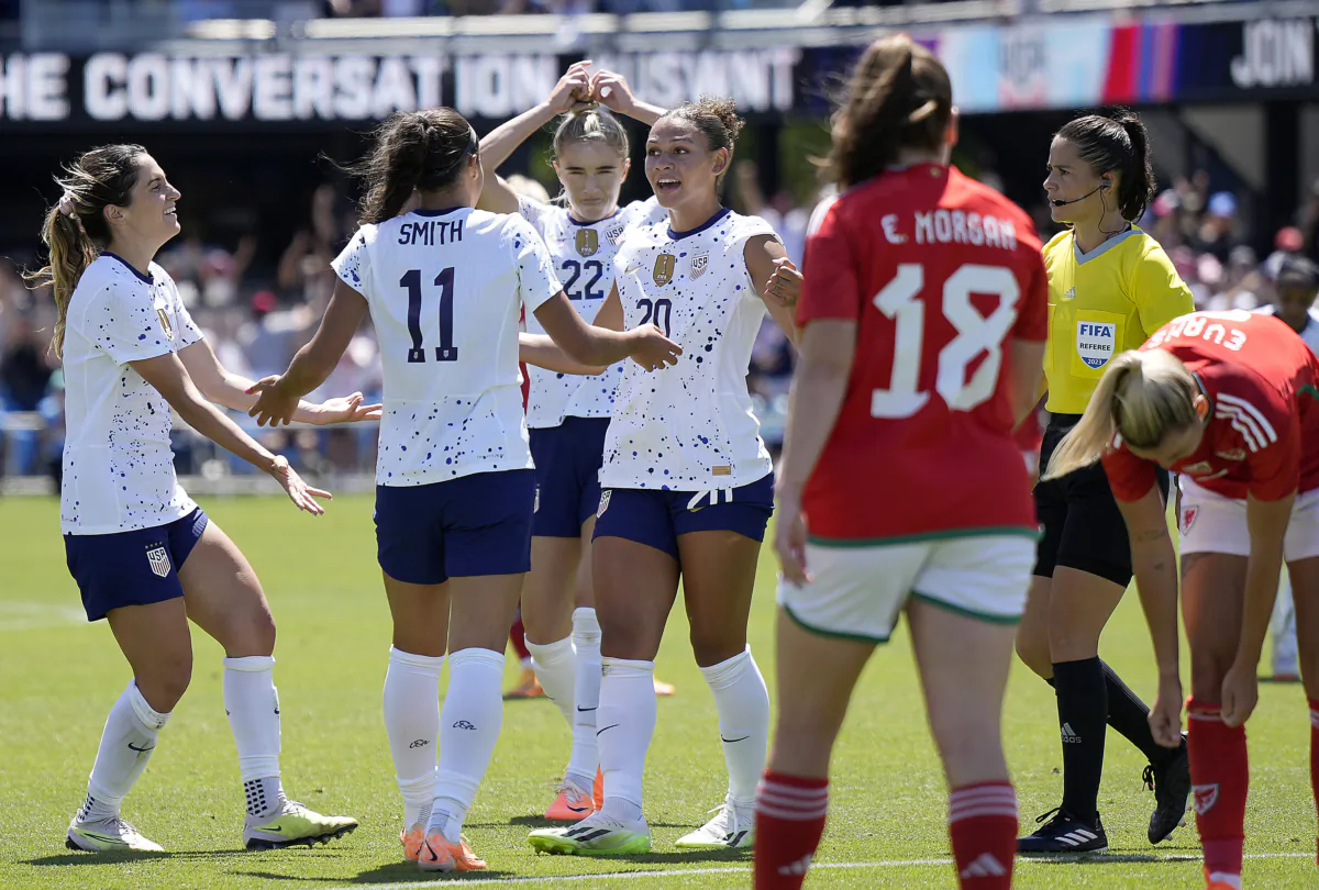Trinity Rodman (20) of the USA Women's National Team celebrates with teammates after she scored her second goal against the Wales National Team in the second half of the Send Off Match at PayPal Park in San Jose on July 9, 2023. (Thearon W. Henderson/Getty Images)