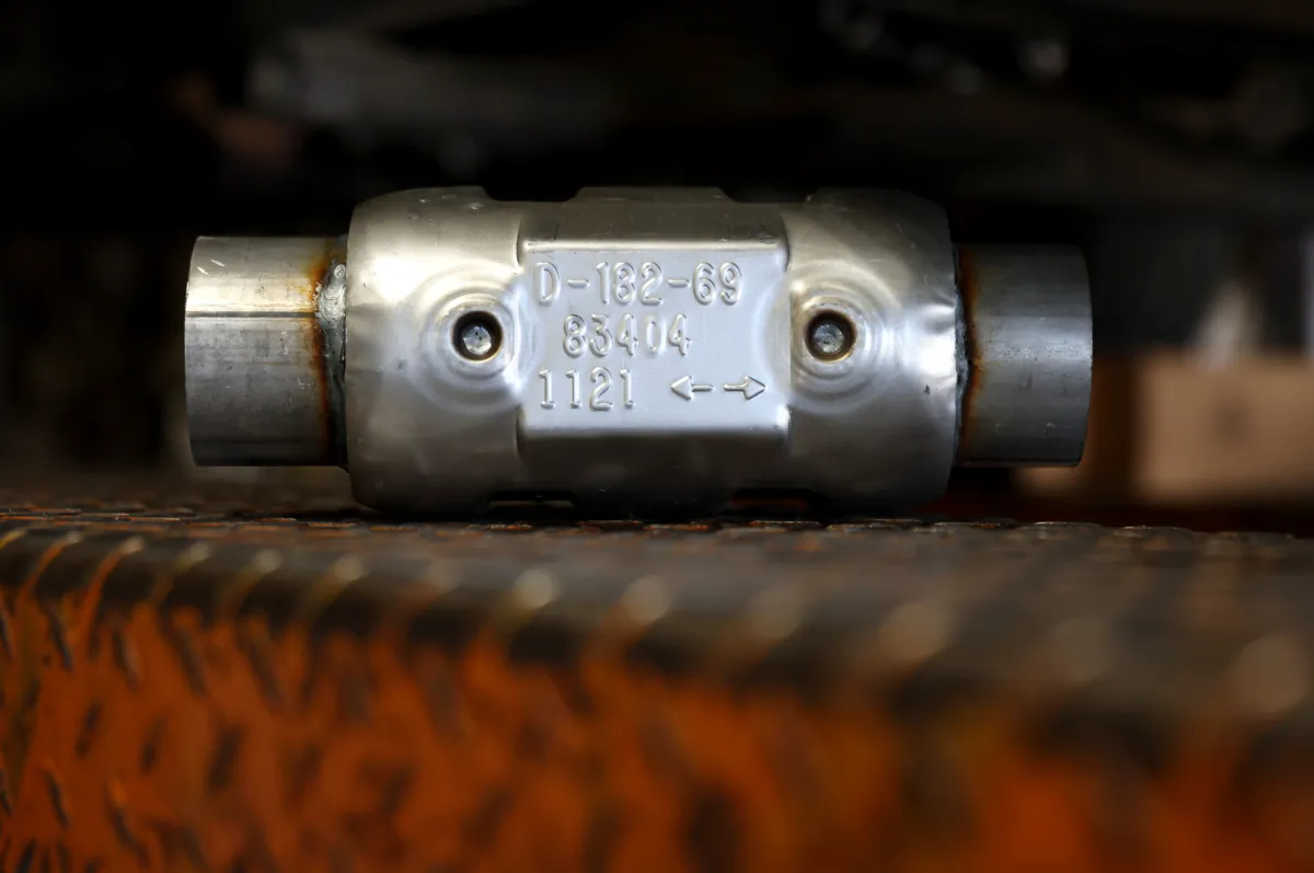 A brand new catalytic converter sits on a car lift at Johnny Franklin's Muffler in San Rafael, California, on July 11, 2022. (Justin Sullivan/Getty Images)